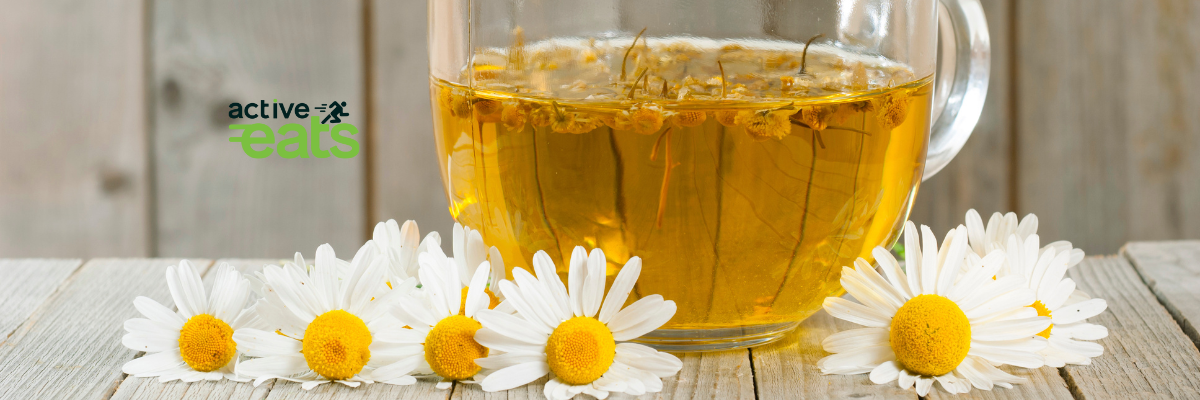picture shows chamomile flowers on top of chamomile tea representing the benefits of chamomile tea on health.
